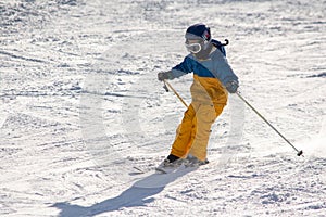 Ski, snow, sun and fun with kids on a snow track,child on ski