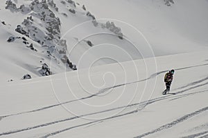 Ski, Snowboard freeride i deep powder snow. Gudauri Georgia Caucasus resort. Freeride in Caucasus mountains. Freeride snowboarding