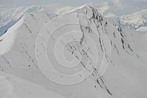 Ski, Snowboard freeride i deep powder snow. Gudauri Georgia Caucasus resort. Freeride in Caucasus mountains. Freeride snowboarding