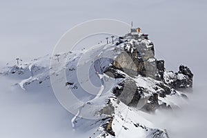 Ski station on the top in the white clouds