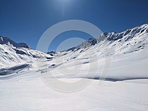 Ski tour on the big mountains above davos with a view of the Fluelapass hospiz. Flueela pass. Ski mountaineering