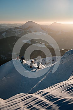 ski tour group of people walks at range of the mountain Marmaros in the Carpathian mountains. Ski touring and freeride