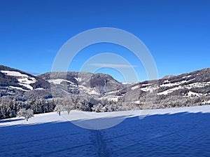 Ski tourer tracks in winter wonderland with scenic panorama mountain view