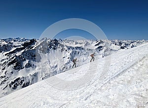 Ski touring group on the ascent towards the Schwarzhorn near Davos. Mountains. Ski mountaineering in the Swiss Alps