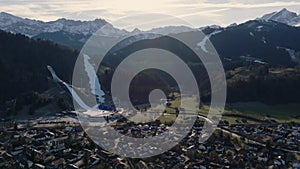 Ski Track in Garmisch Partenkirchen, Winter. Aerial of Bavarian village in Alps mountains. Sunny day in Germany, Europe.