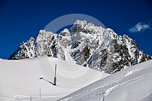 Ski tracks on the fresh snow at the off piste area at the Meribel Ski Resort in France.