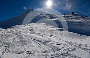 Ski tracks on the fresh snow at the off piste area at the Meribel Ski Resort in France.