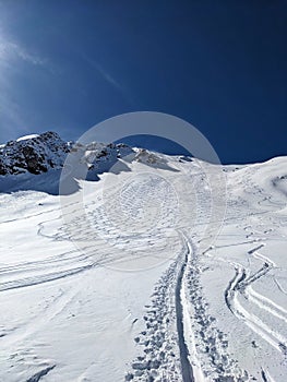 ski tracks on mountain bulenhorn monstein davos. beautiful deep snow descent in the snow. Ski touring in the mountains.