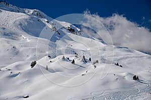 Ski tracks on the off piste terrain at the Meribel Ski Resort in France.