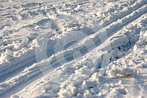 Ski trail on the snow background