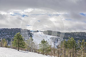 Ski trail on winter season on Divcibare mountain in Serbia with cloudy sky