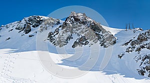 Ski trails on snow mountains photo