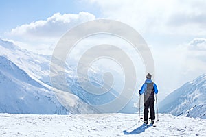 Ski vacation, skiing background, skier in beautiful mountain landscape, winter holidays