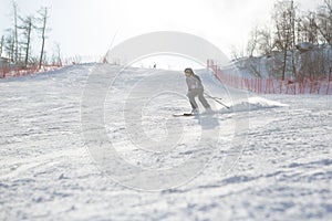 Ski, winter fun - lovely skier girl enjoying skiing