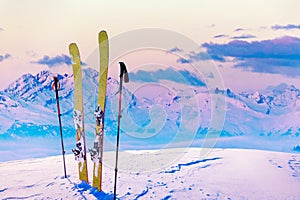 Ski in winter season, mountains and ski touring backcountry equipments on the top of snowy mountains in sunny