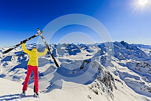 Ski in winter season, mountains and ski touring backcountry equipments on the top of snowy mountains in sunny