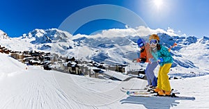 Ski in winter season, mountains and ski touring equipments on the top in sunny day in France, Alps above the clouds photo