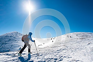Skialpinist on snowy mountains