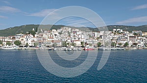 Skiathos Island, Greece - June 2020. View of the city of Skiathos by a boat.