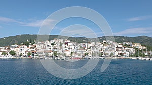 Skiathos Island, Greece - June 2020. View of the city of Skiathos by a boat.