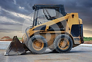 Skid loader, or skid-steer loader