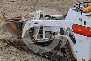 small excavator Bobcat at construction site Skid loader on construction site