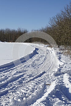 Skid marks into a snowscape