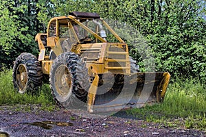 Skidder With A Snow Plow
