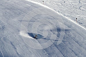 Skier on black ski run