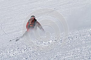 Skier carving on piste