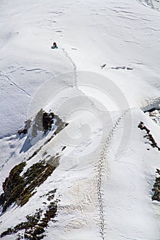 Skier climbing a snowy mountain