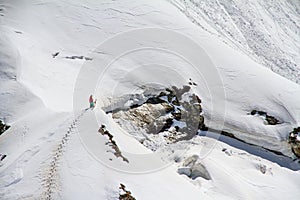 Skier climbing a snowy mountain