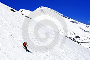 A skier descending Mount Elbrus - the highest peak in Europe.