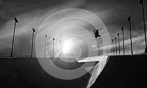 Skier doing an inverted trick in winter snow halfpipe