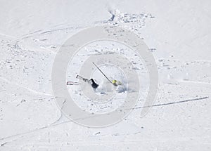 Skier after falling down on mountain slope