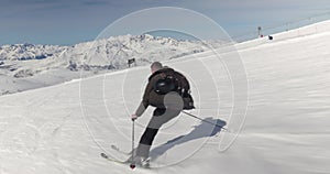 Skier fast follow action shot skiing