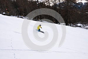 Skier go down on the slope of alps