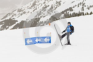 Skier having fun on top of the mountain. Playing with skis