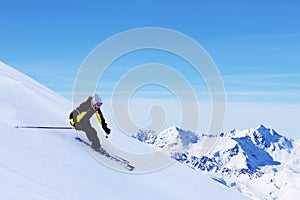 Skier in high mountains