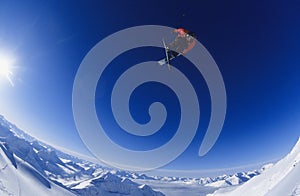 Skier Jumping Against Blue Sky