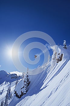 Skier Jumping From Mountain