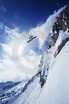 Skier Jumping From Mountain