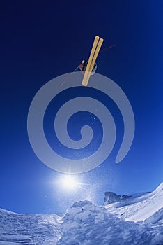 Skier Jumping From Mountain Cliff