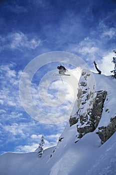 Skier Jumping From Mountain