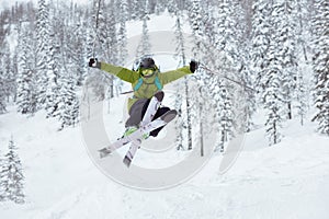 Skier jumps offpiste ski slope resort photo