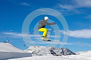 Skier jumps in snow park