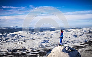 Skier is looking out to the horizon