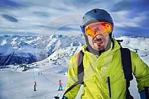 Skier man in winter mountains