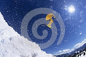 Skier in midair above snow photo