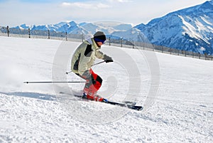 Skier moving down a ski track